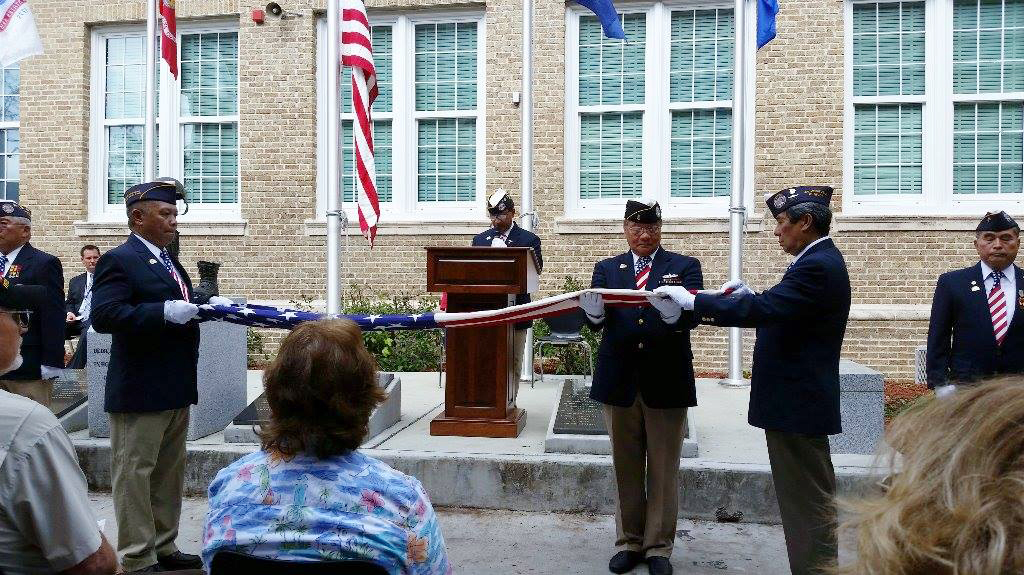 Flag folding at the Lee High School Fallen Heroes Re-dedication Ceremony